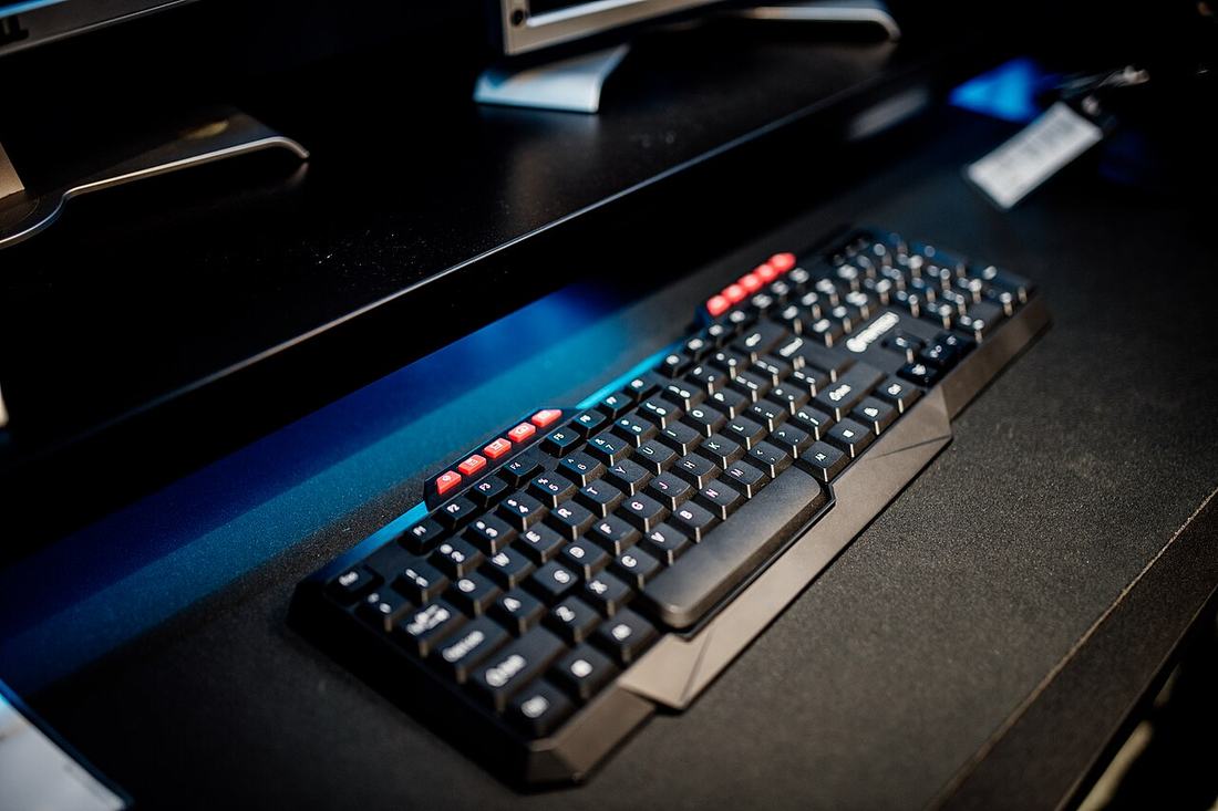 A computer keyboard on a desk